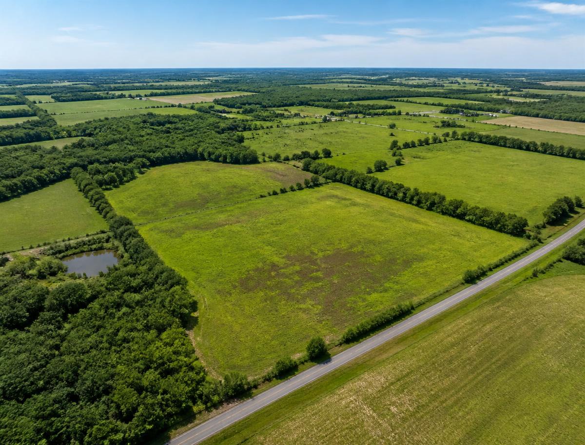 Aerial view of rural land parcels along a country road